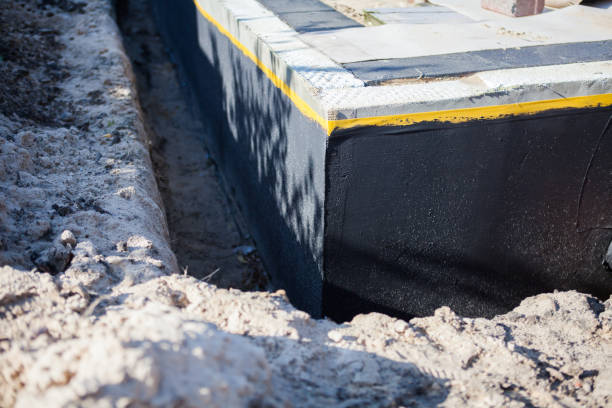 Professional Basement Waterproofing technician working in Monmouth Beach, NJ